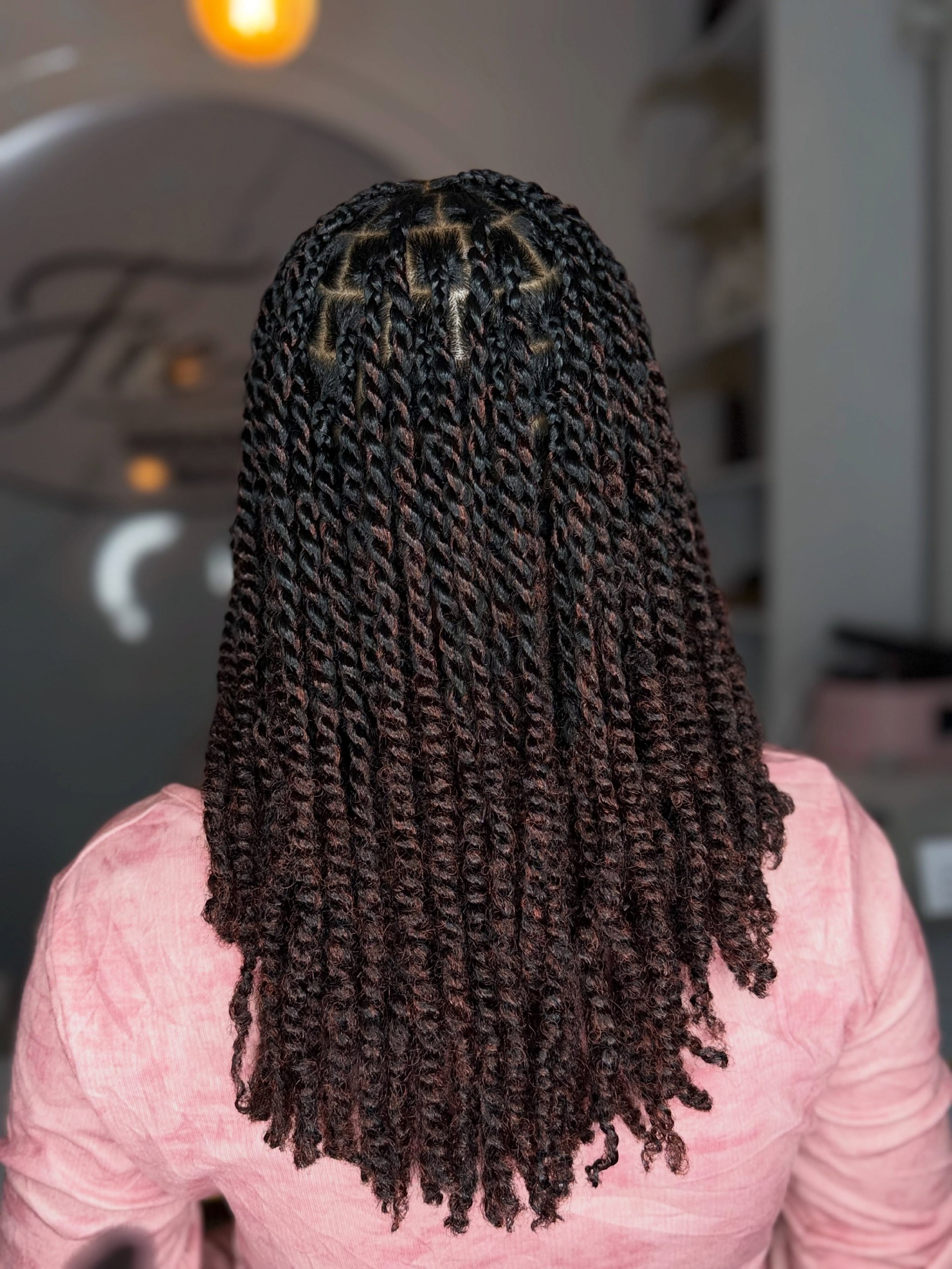 Defined Kinky Twists With Deep Burgundy Highlights