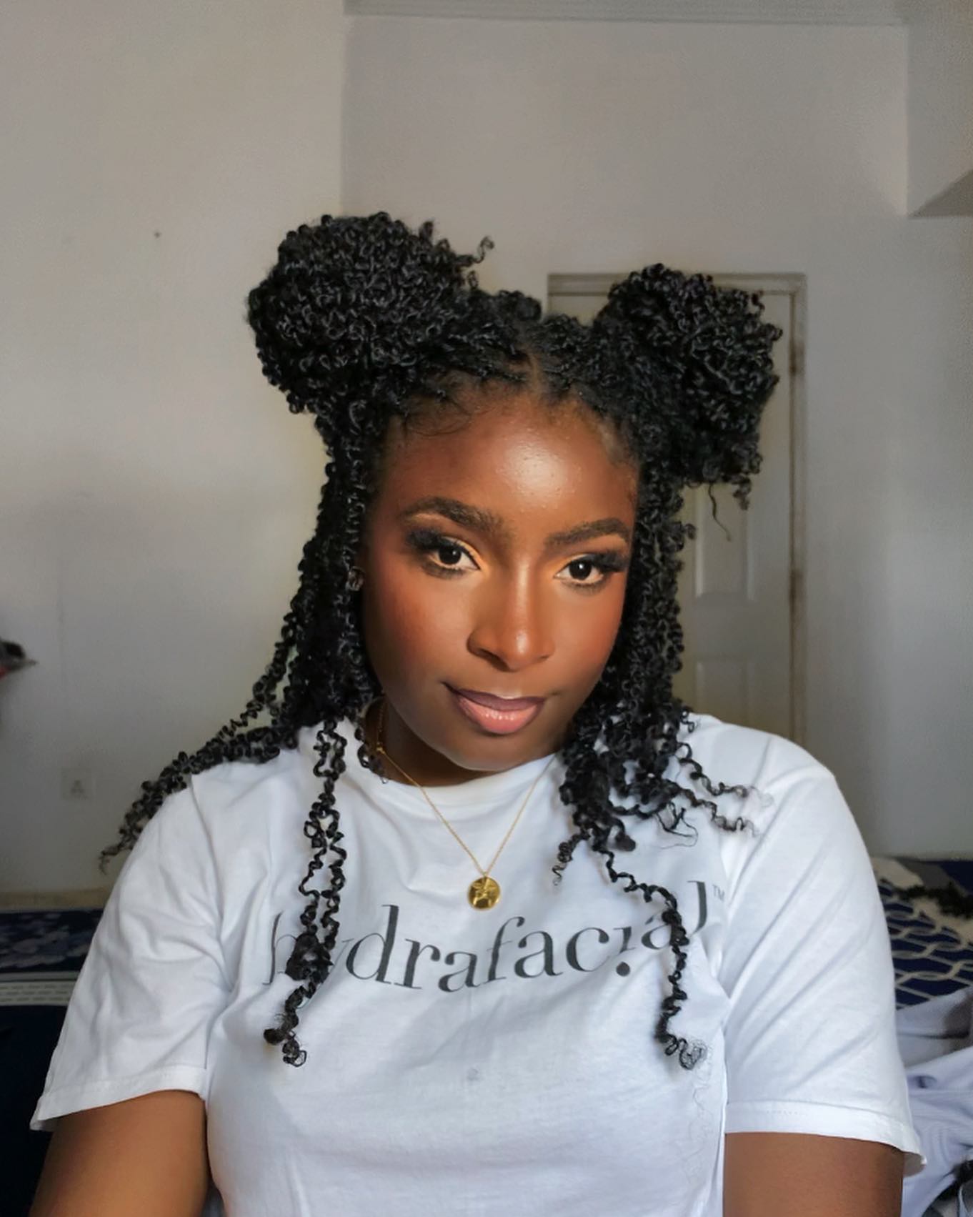 Double Bun Mini Twists With Loose Tendrils