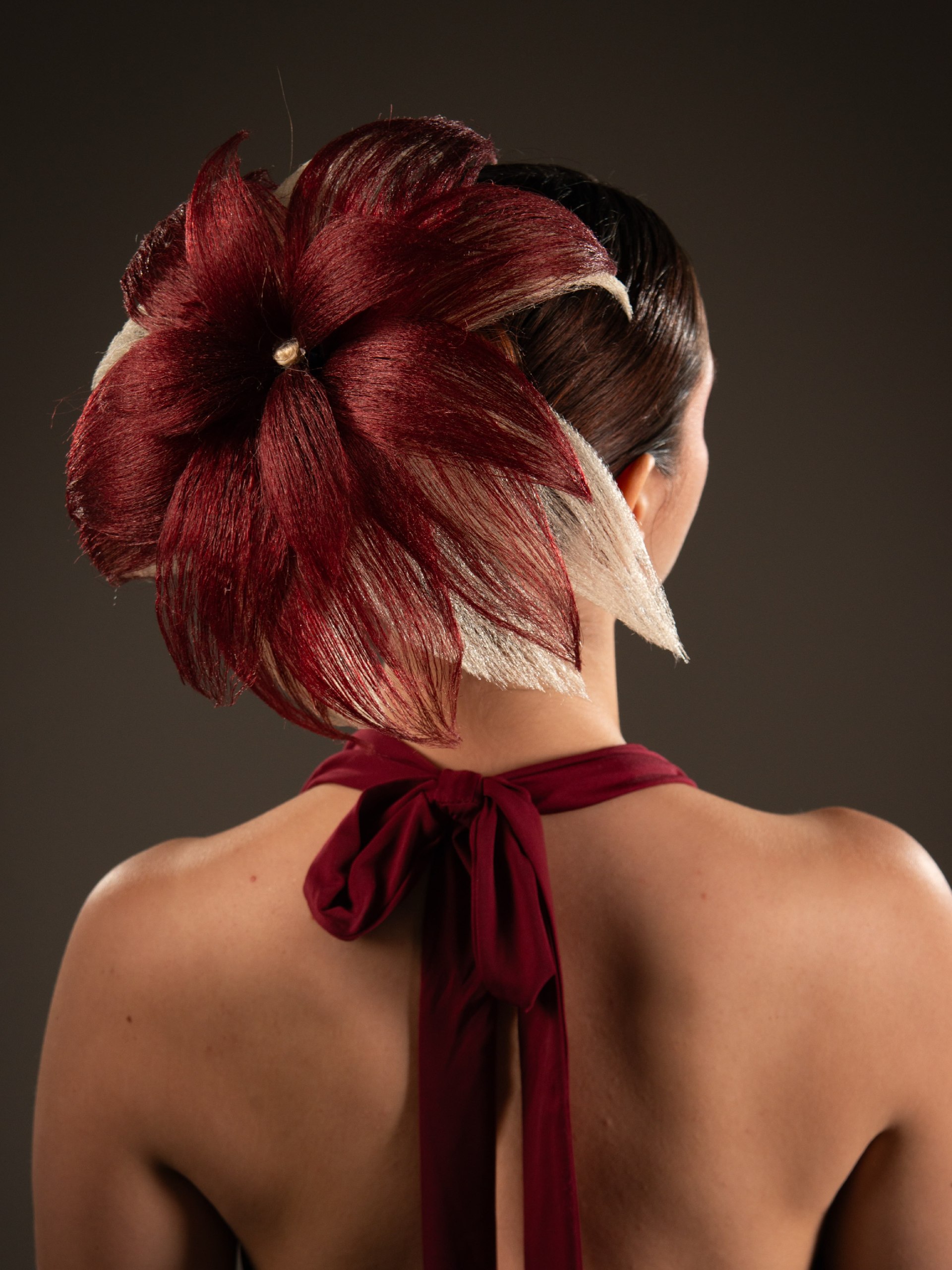 Dramatic Floral Hairpiece With Sleek Updo