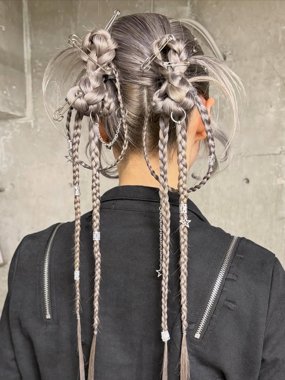Edgy Braided Space Buns With Silver Accents
