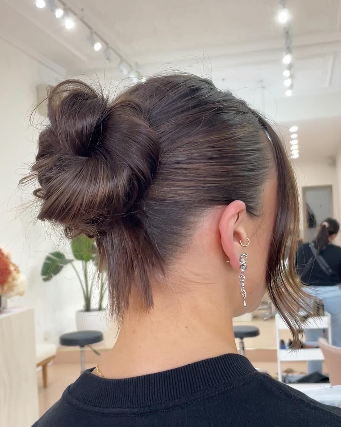 Effortless Chic Messy Low Bun With Face-Framing Strands