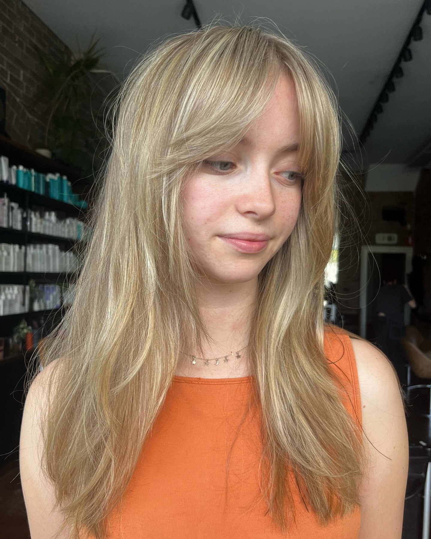 Effortless Curtain Bangs With Honey Blonde Layers