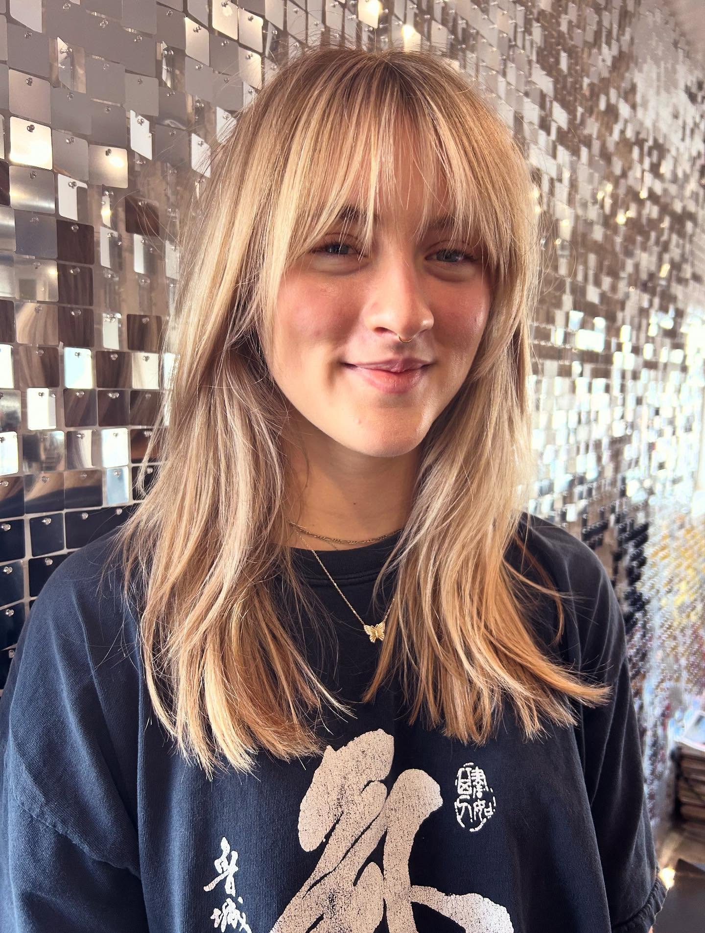 Effortless Honey Blonde Shag With Wispy Bangs