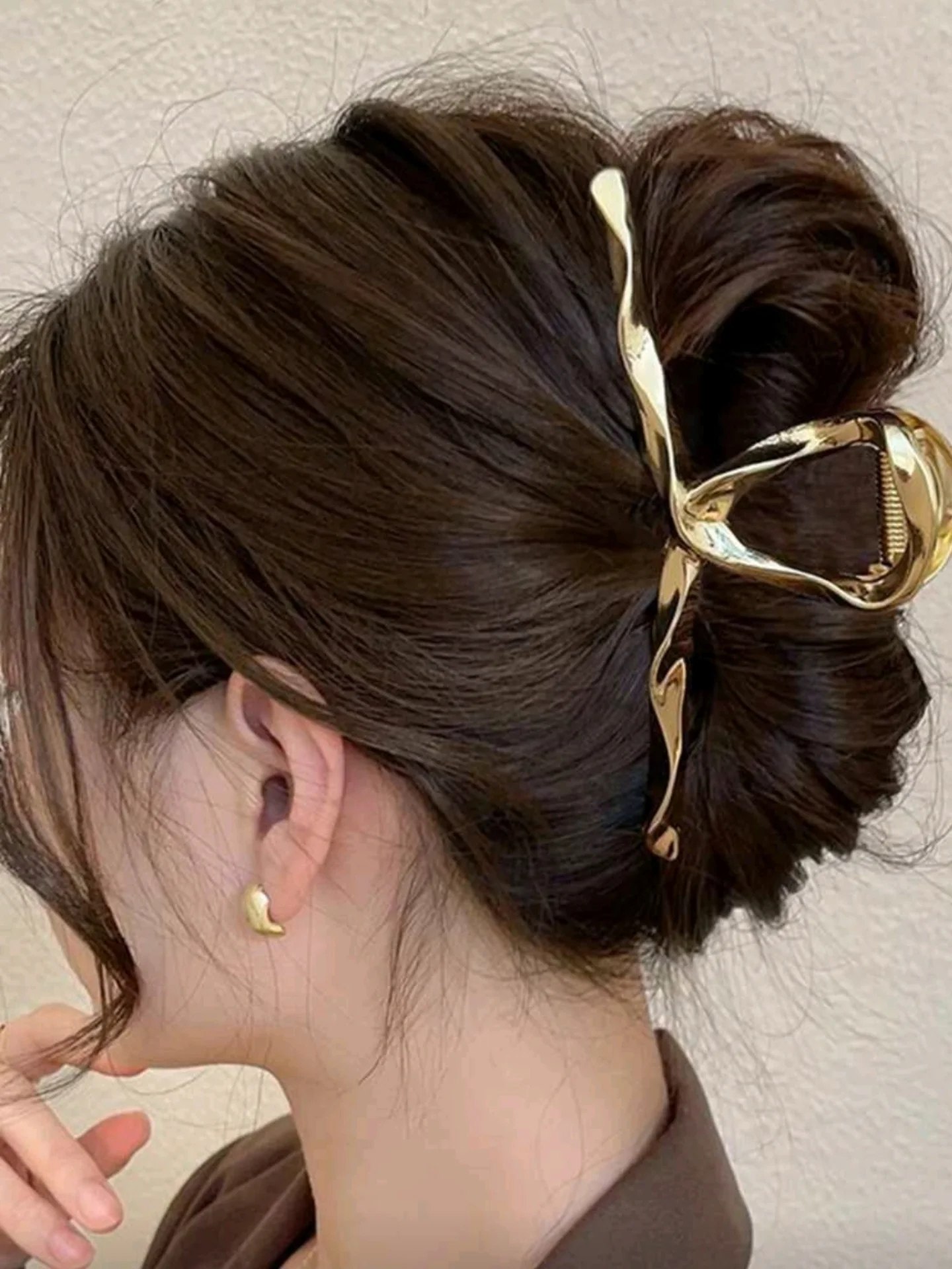 Effortless Twisted Bun With Chic Gold Claw Clip