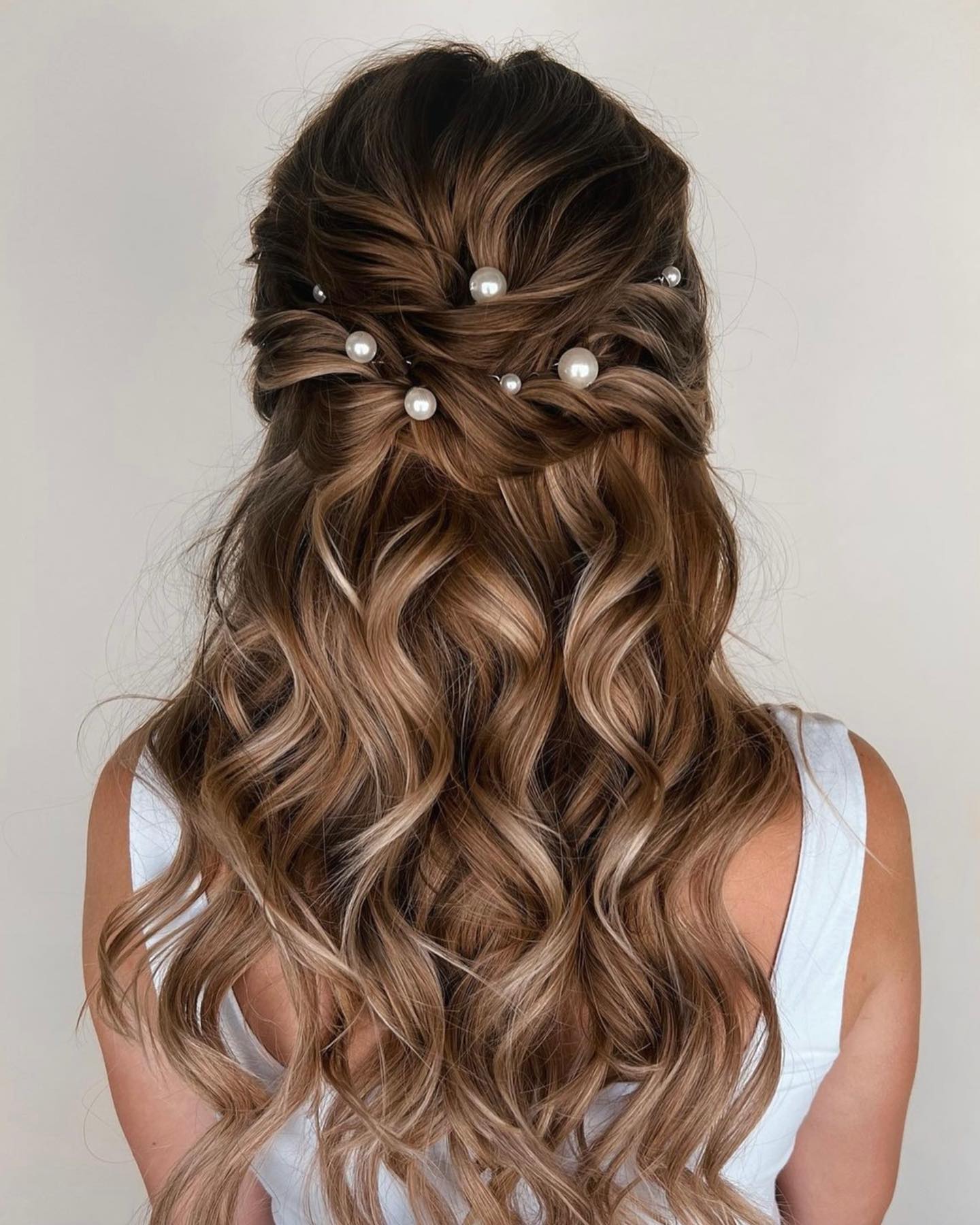 Elegant Half Updo With Loose Waves And Pearls