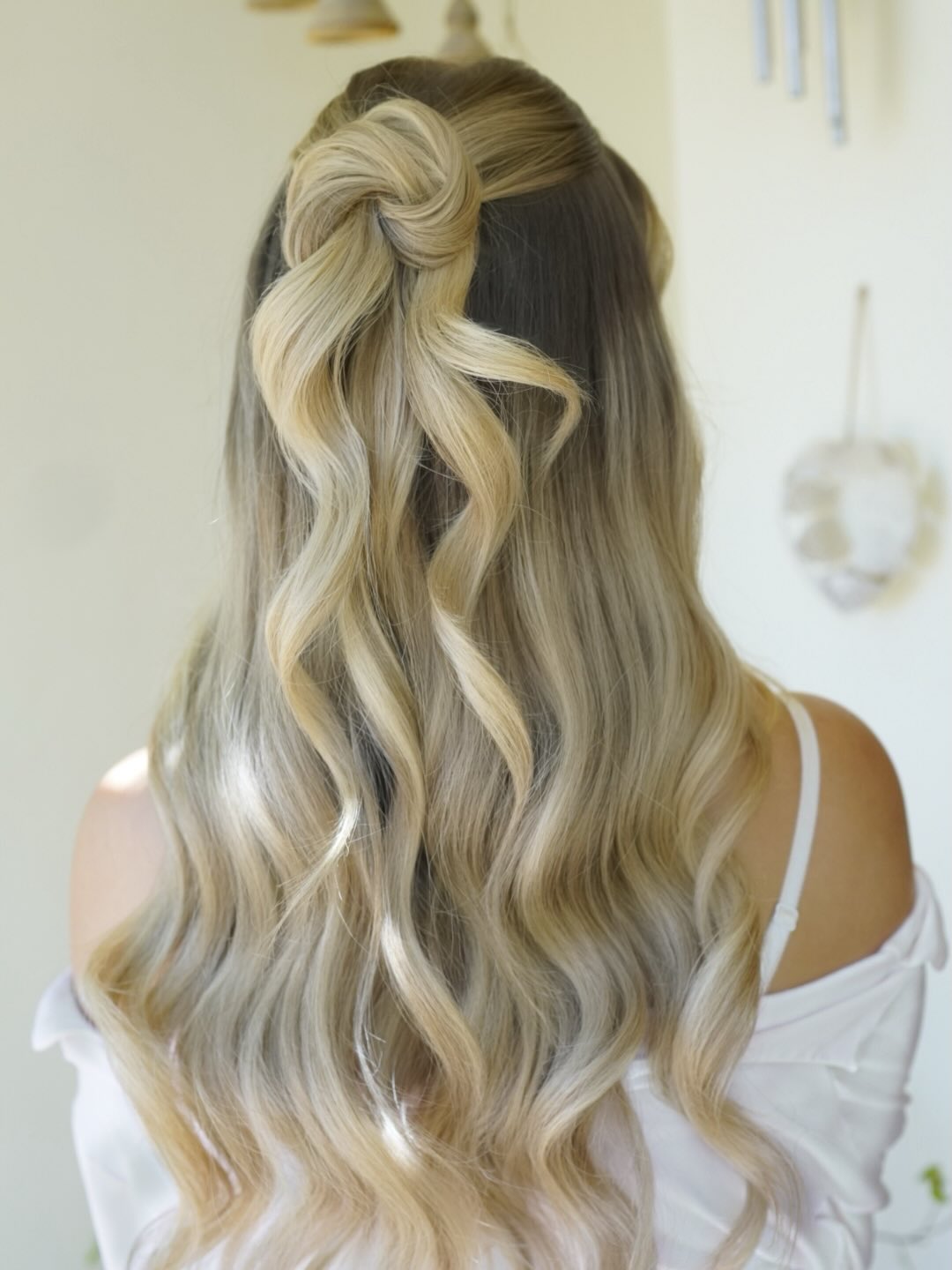 Elegant Twisted Half-Up Style With Loose Waves