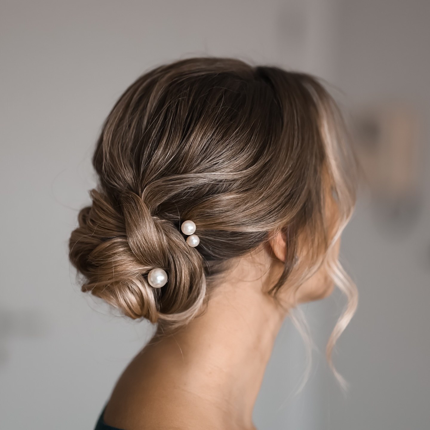 Elegant Twisted Low Bun With Pearl Accents