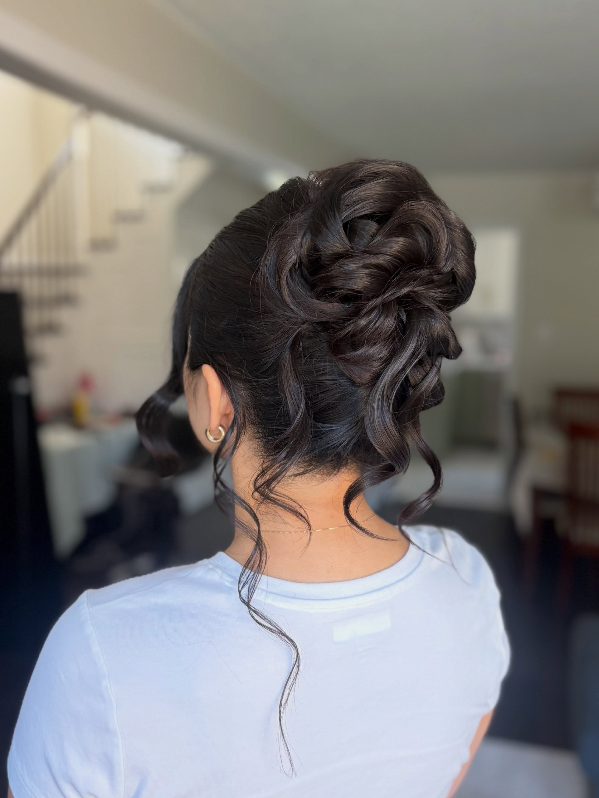 Elegant Twisted Updo With Loose Face-Framing Tendrils