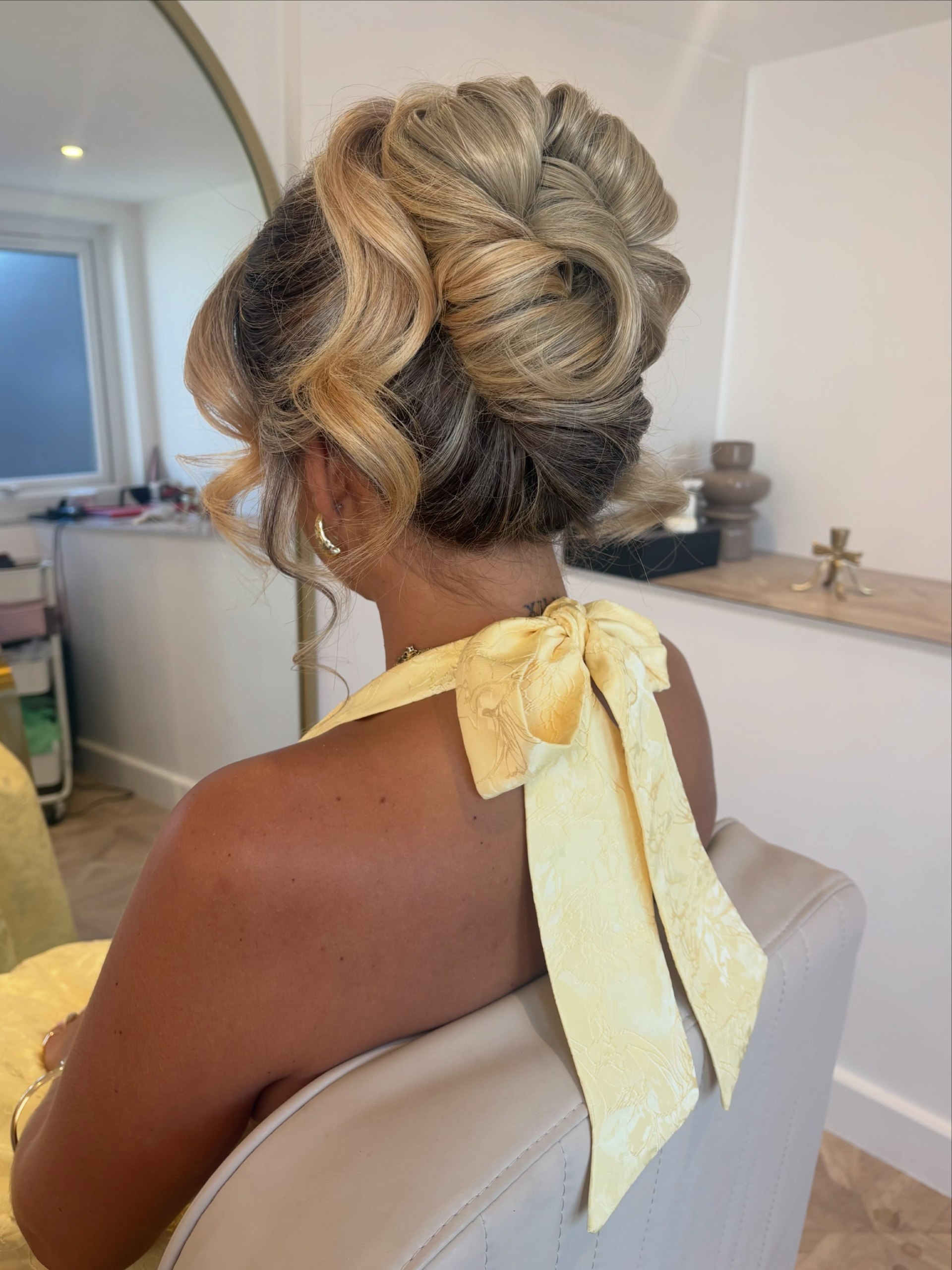 Elegant Updo With Voluminous Curls For Prom
