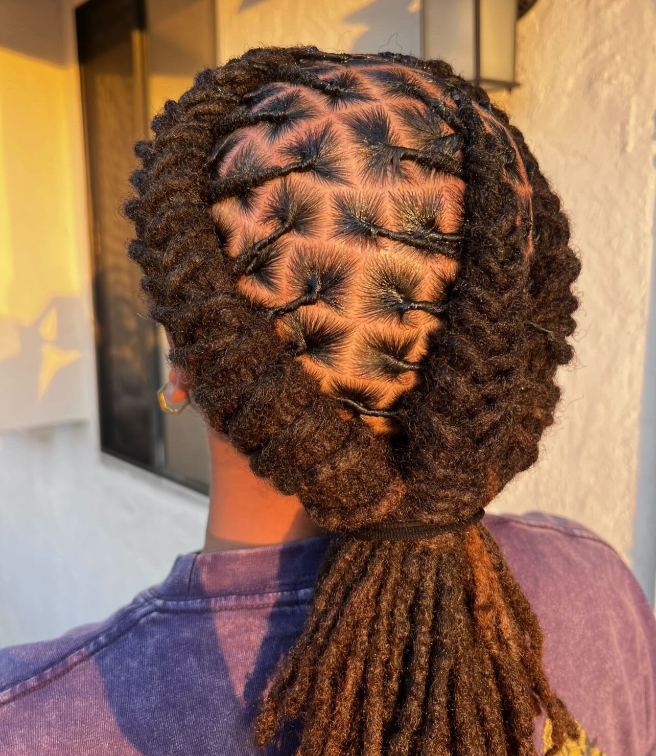Geometric Top Knot With Loose Dreadlock Tail