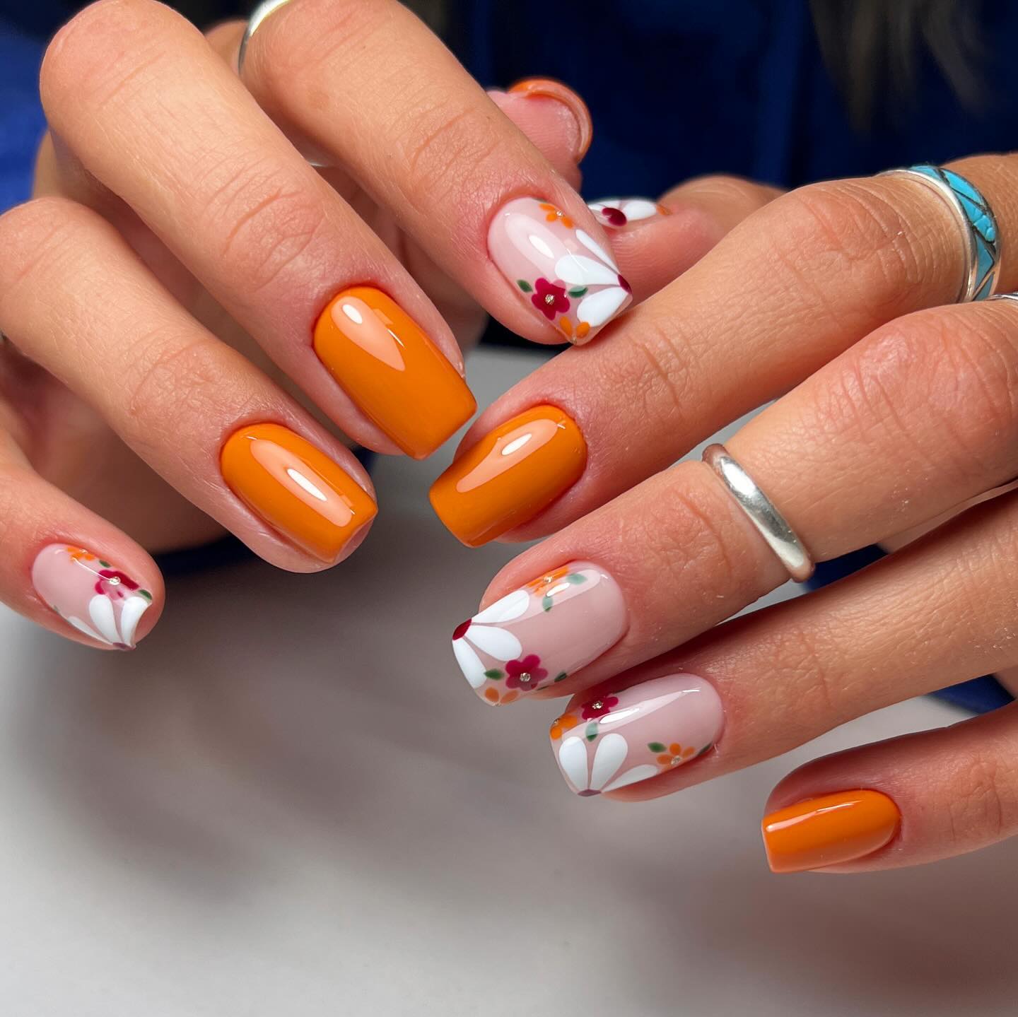 Glossy Orange and Floral French Tip Nails