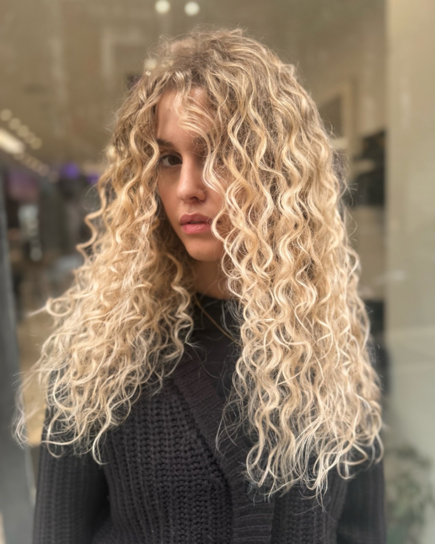 Golden Blonde Beachy Curls With Face-Framing Layers