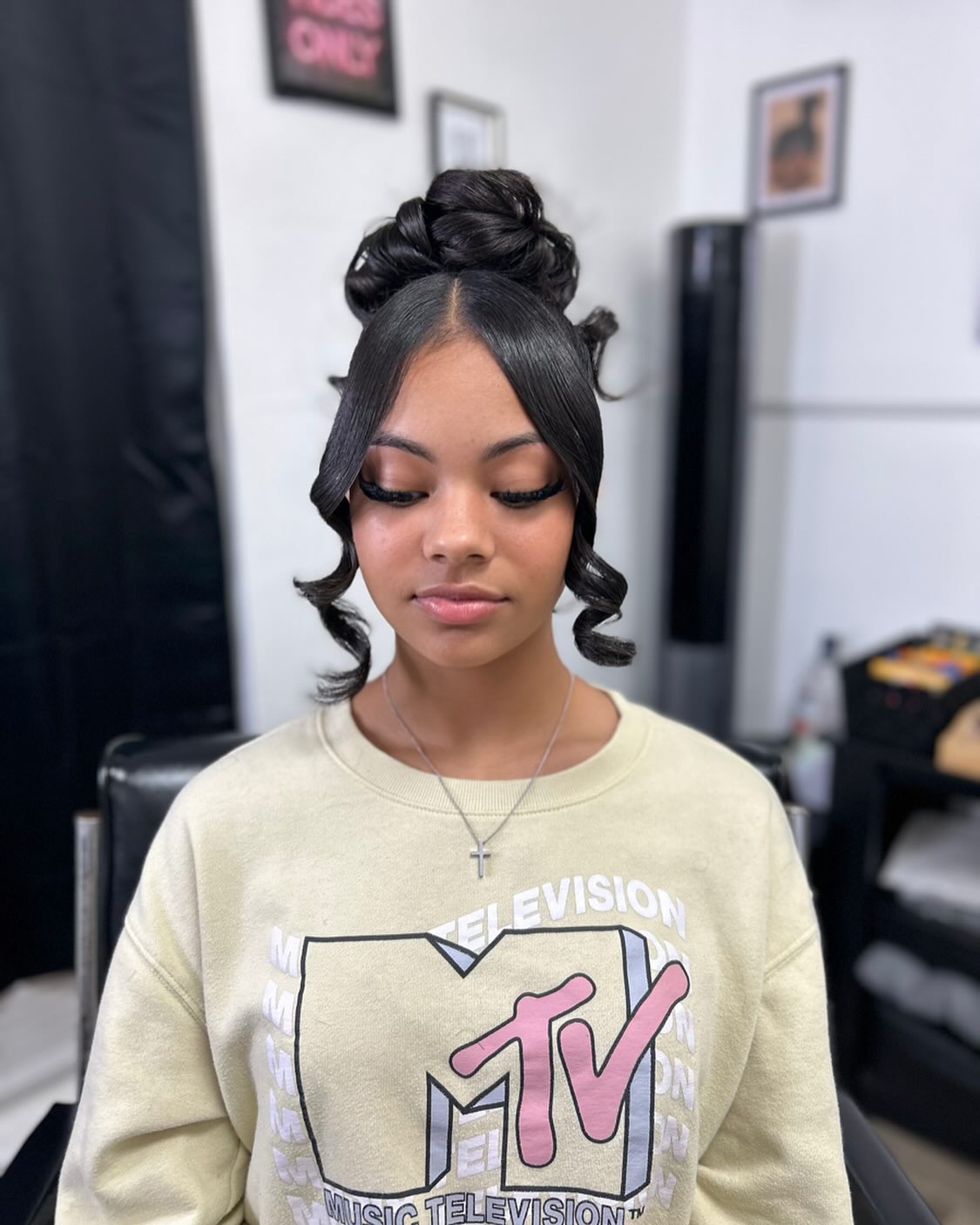 High Top Knot With Defined Face-Framing Curls
