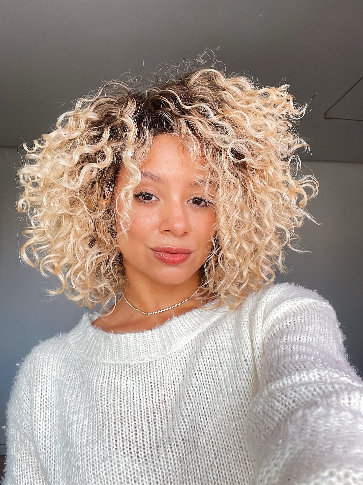 Honey Blonde Beachy Curls With Face-Framing Layers