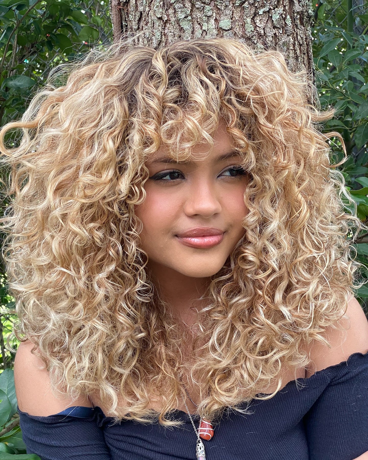 Honey Blonde Curly Shag With Tousled Bangs