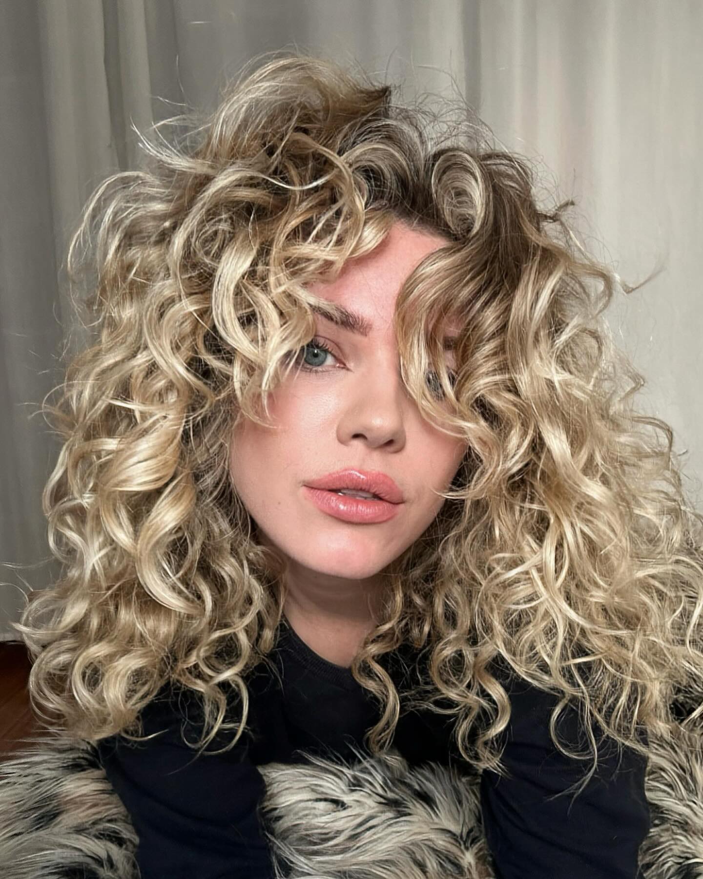 Honey Blonde Textured Curly Hair With Face Framing