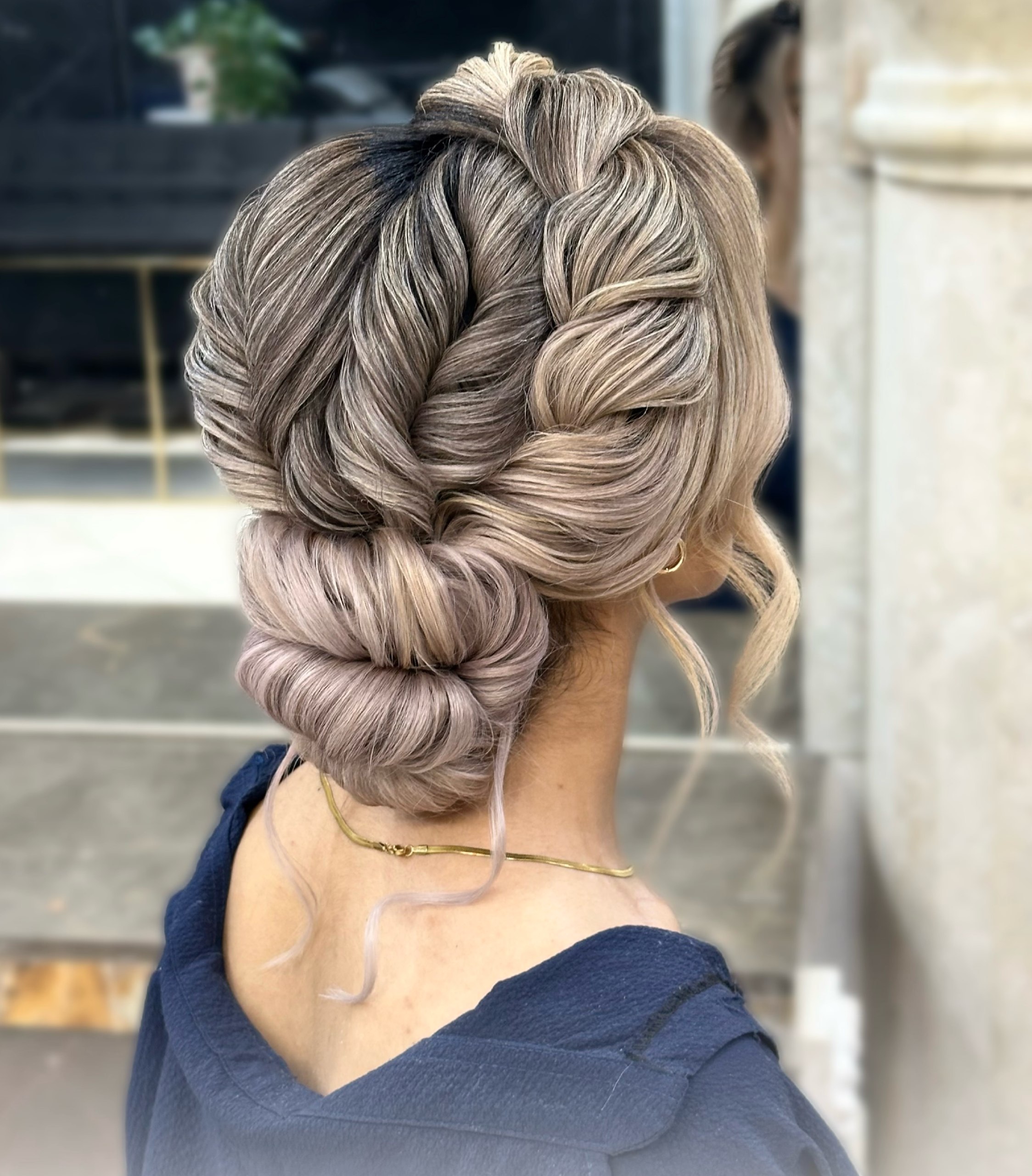 Intricate Braided Updo With Rolled Bun