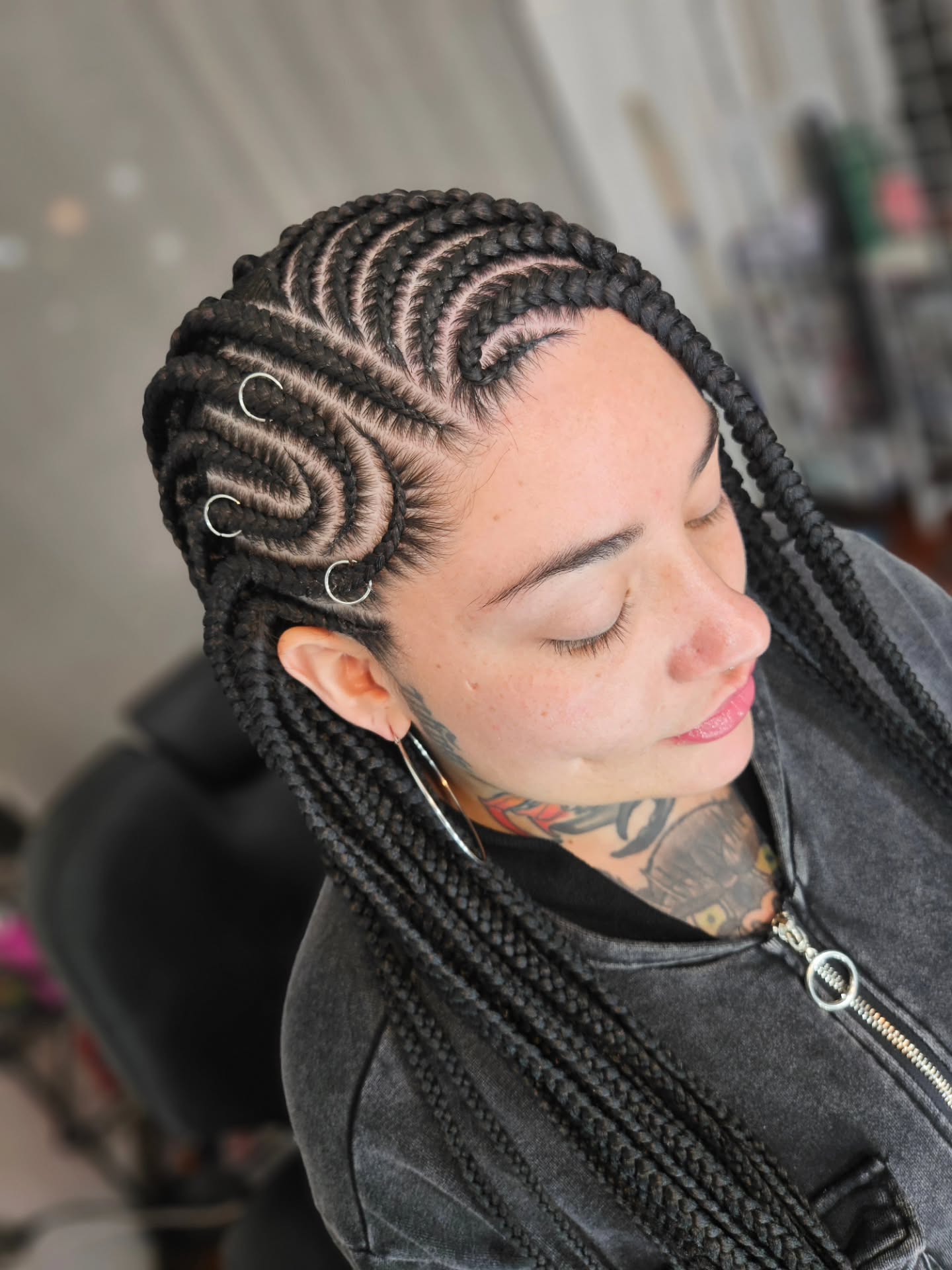 Intricate Cornrows With Silver Hoop Adornments