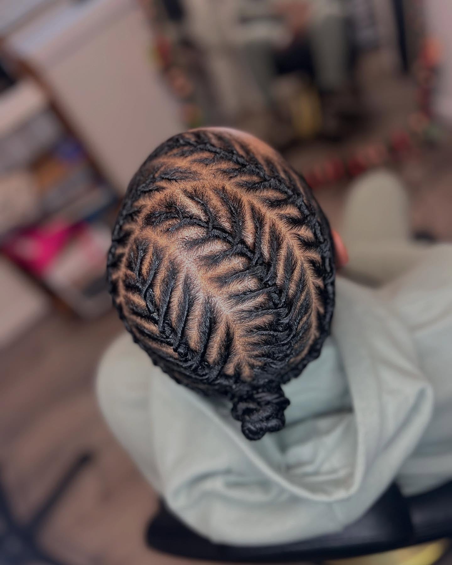 Intricate Herringbone Cornrow Braids With Bun