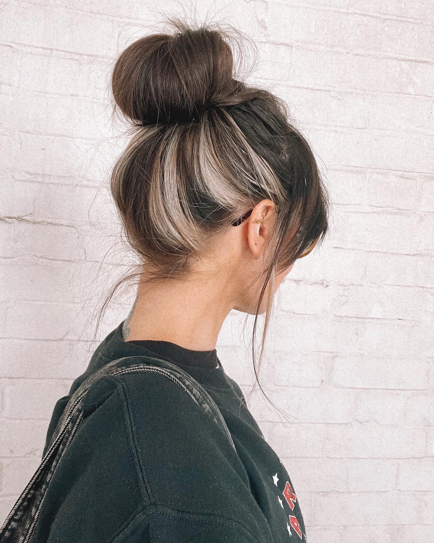 Messy Top Knot With Face-Framing Strands