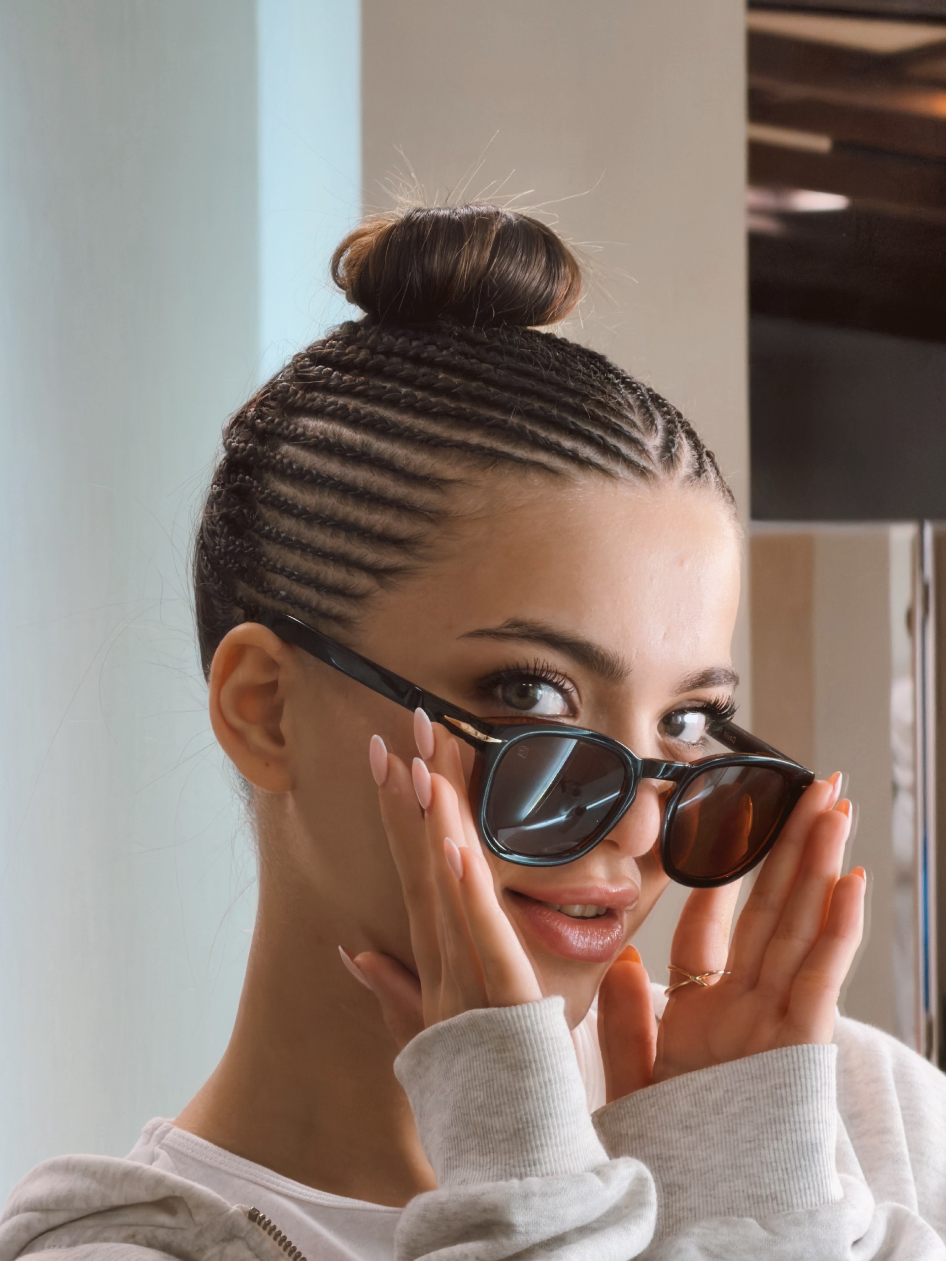 Neat Cornrows With A Chic Top Knot Bun