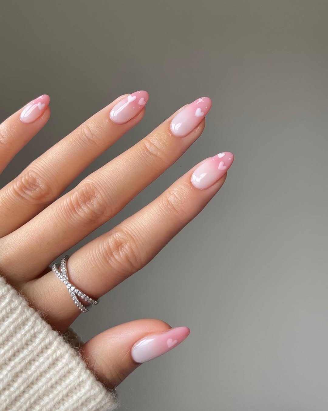 Pink Ombre Nails with White Heart Accents