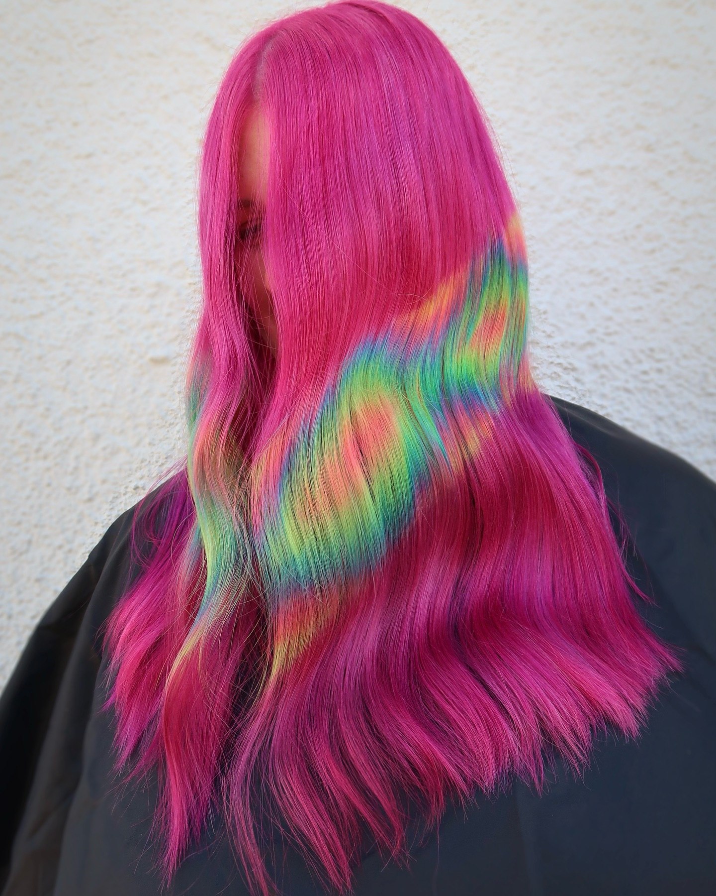 Rainbow Streaks On Vibrant Pink Long Hair
