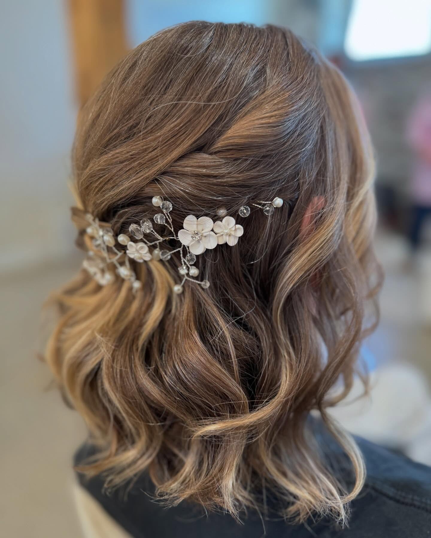 Romantic Braided Updo With Floral Hairpiece