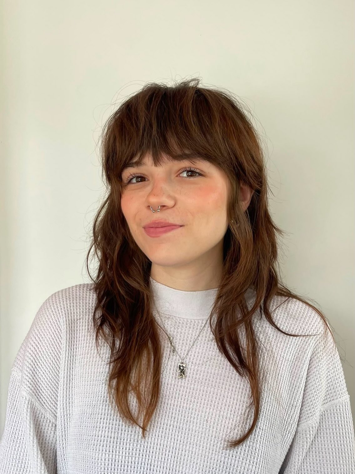 Shaggy Layers With Wispy Bangs And Subtle Waves
