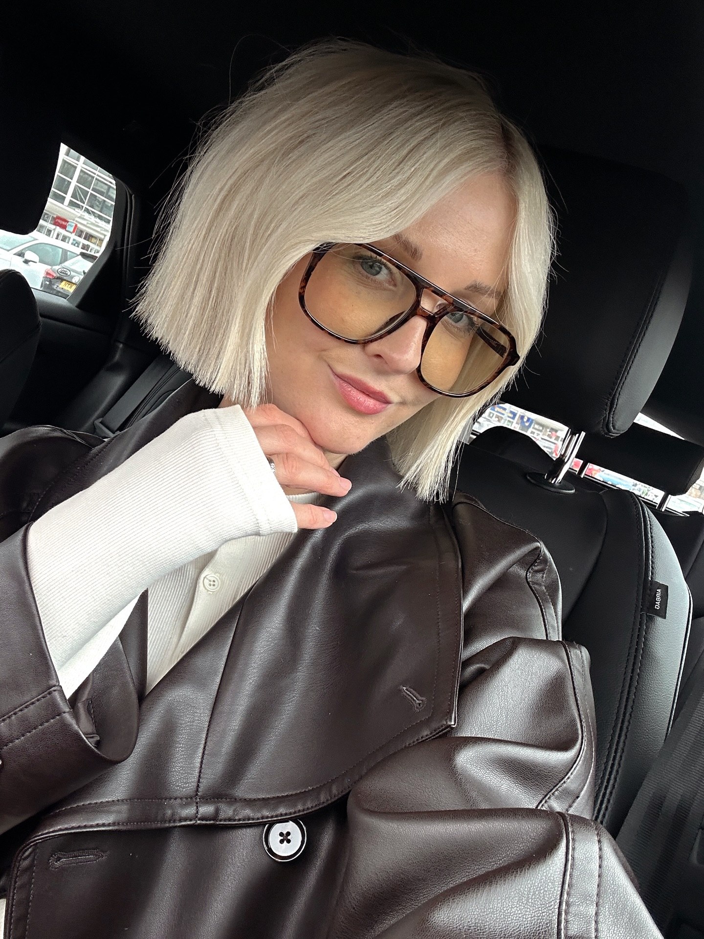 Sharp Platinum Blonde Blunt Bob With Subtle Waves