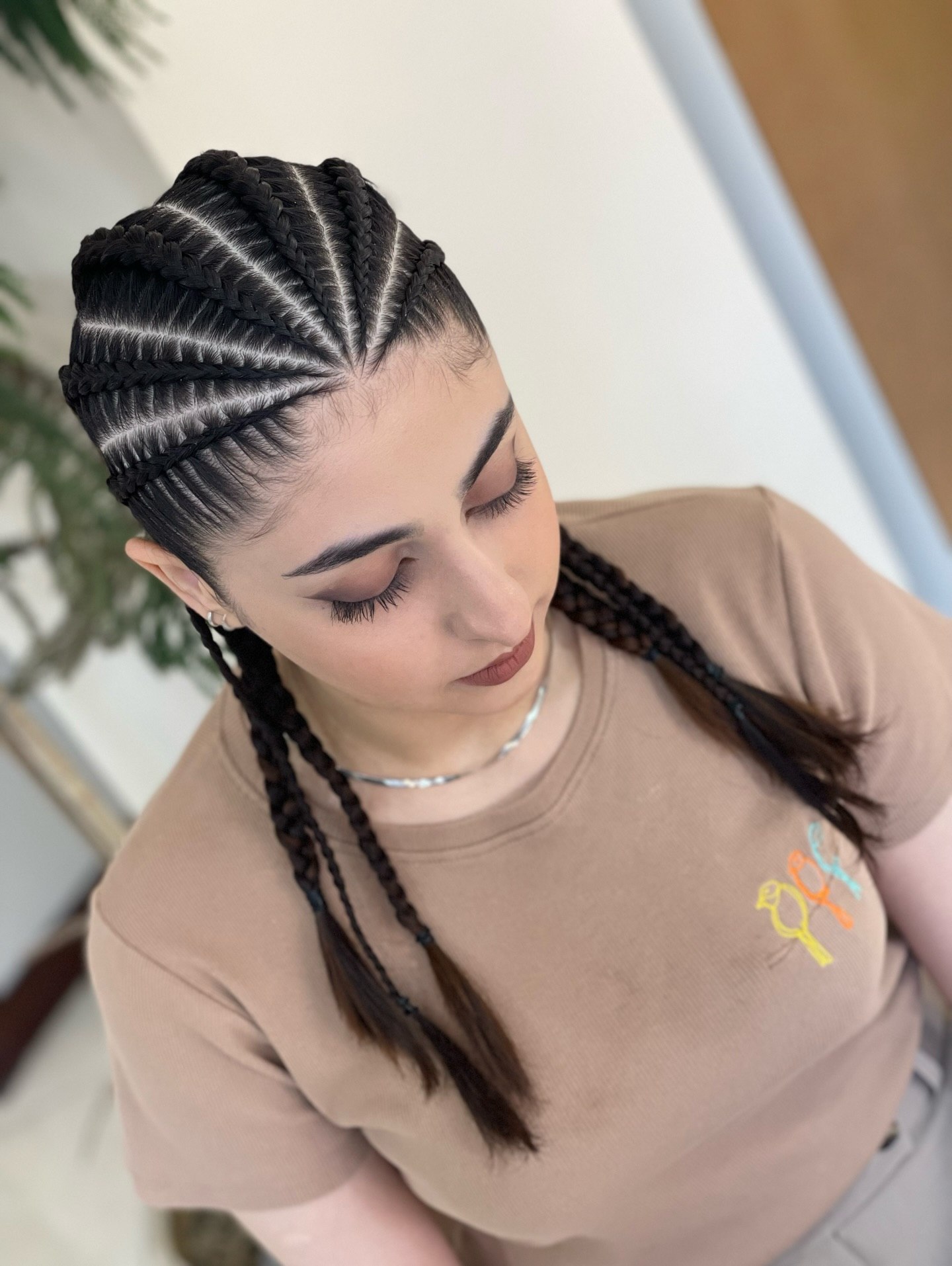 Sharp Side-Parted Cornrows With Subtle Braided Pigtails