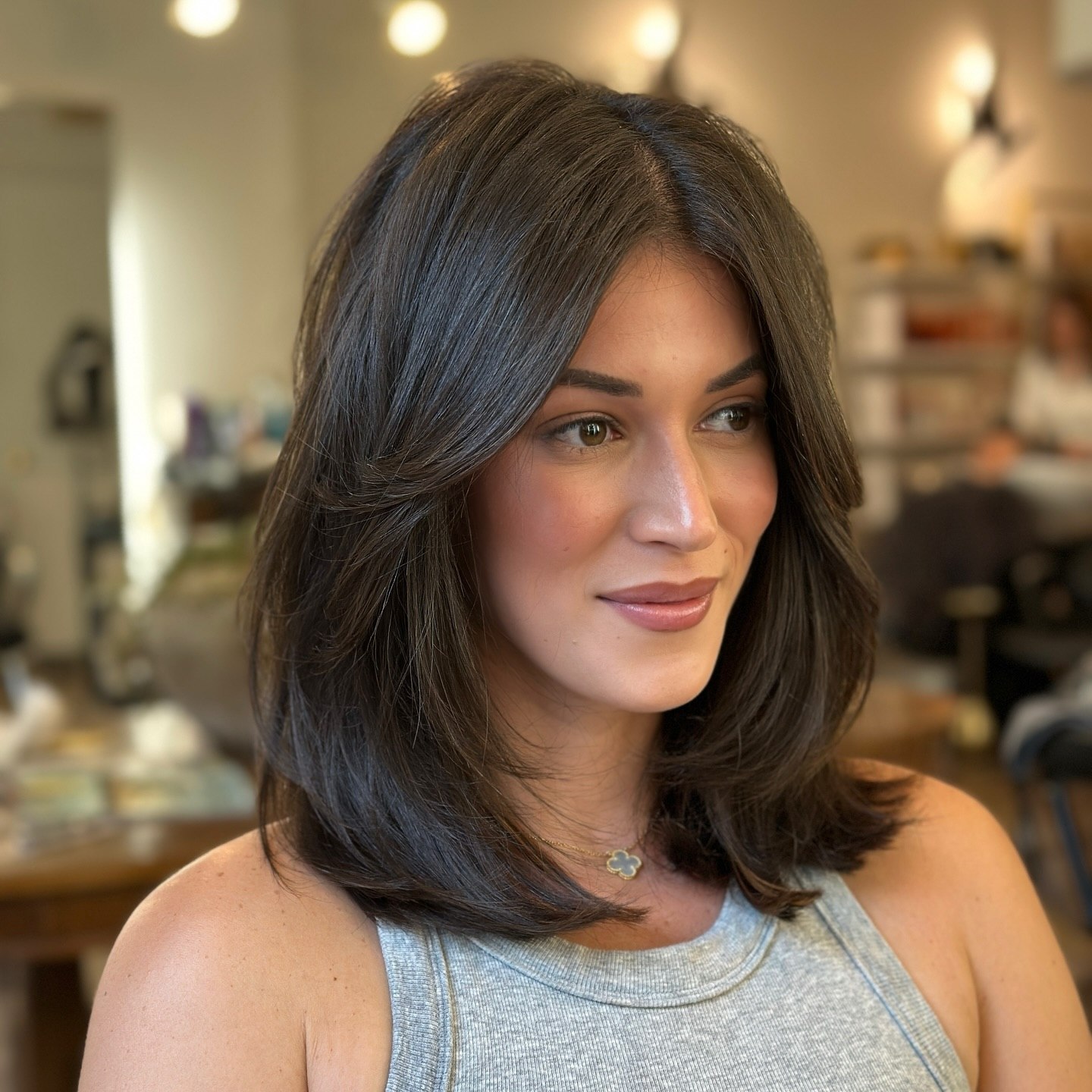 Sophisticated Layered Lob With Face Framing Curtain Bangs