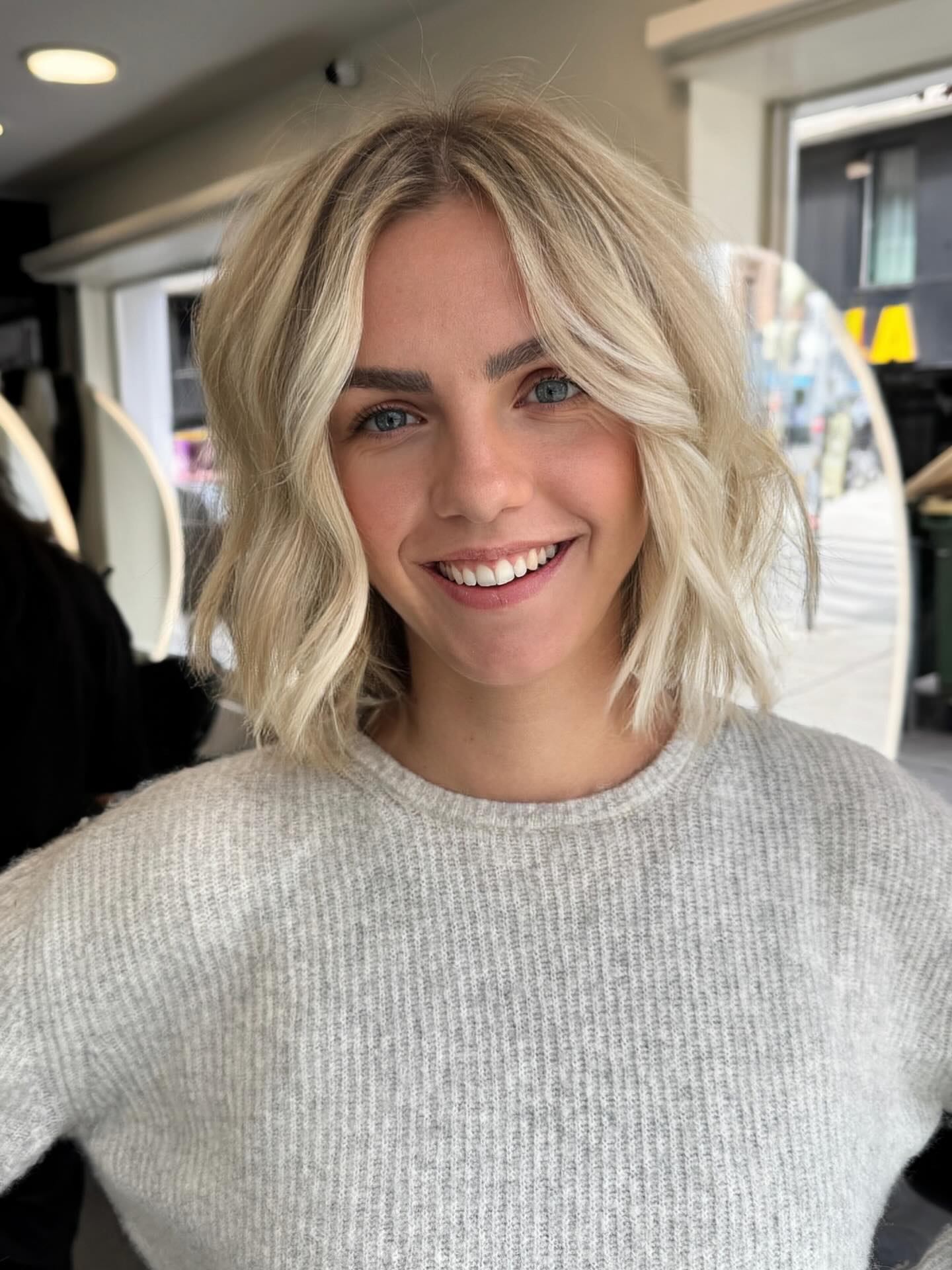 Tousled Blonde Bob With Face Framing Waves