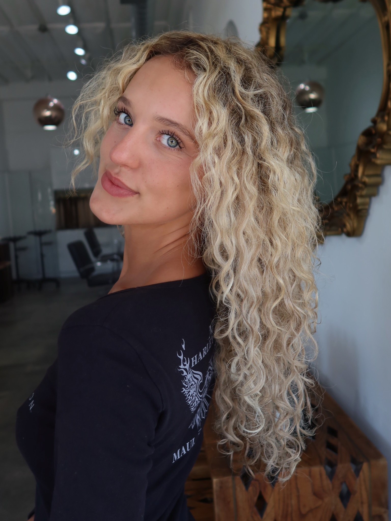 Tousled Honey Blonde Curls With Face-Framing Layers