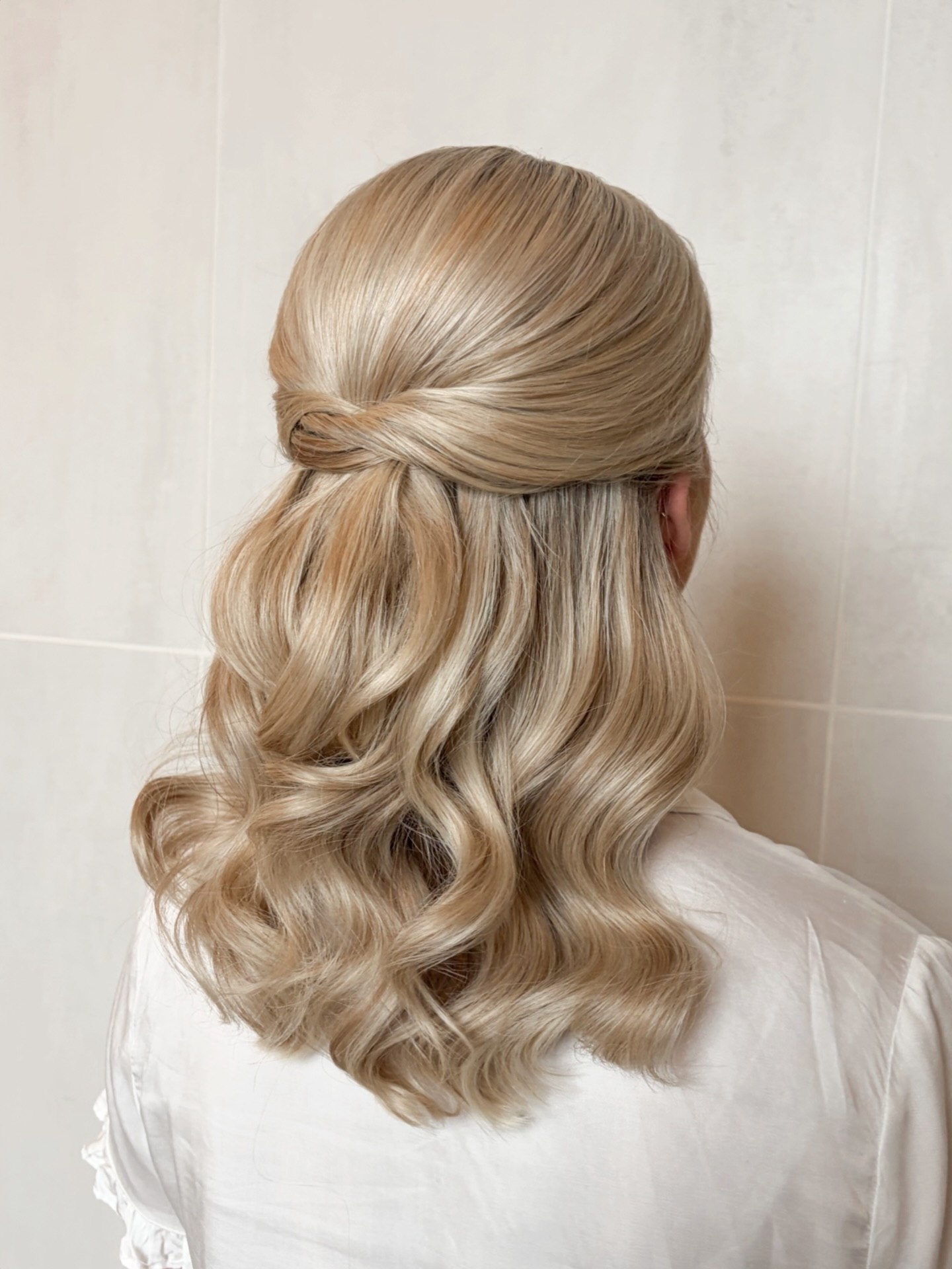 Twisted Half-Up Blonde Waves With Face-Framing Detail