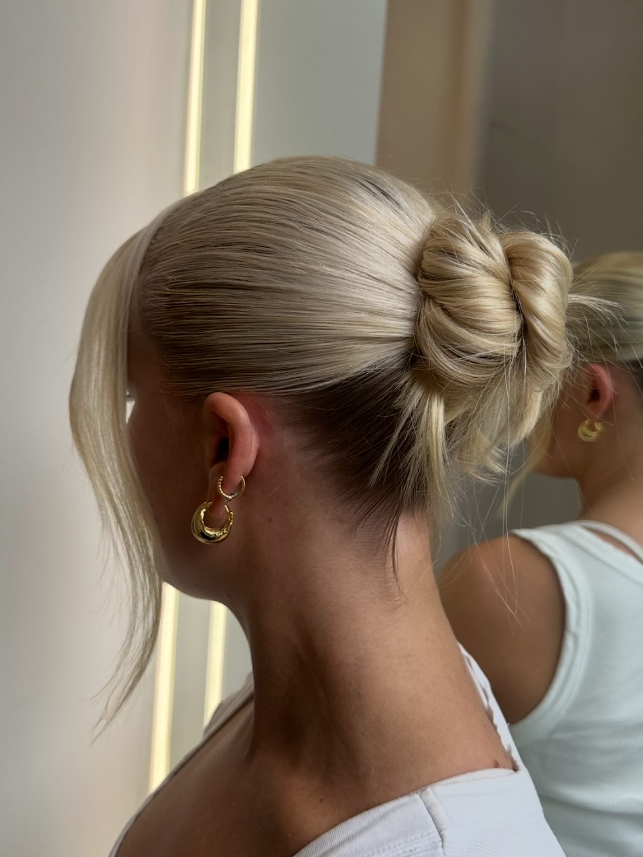 Twisted Low Bun With Face Framing Pieces