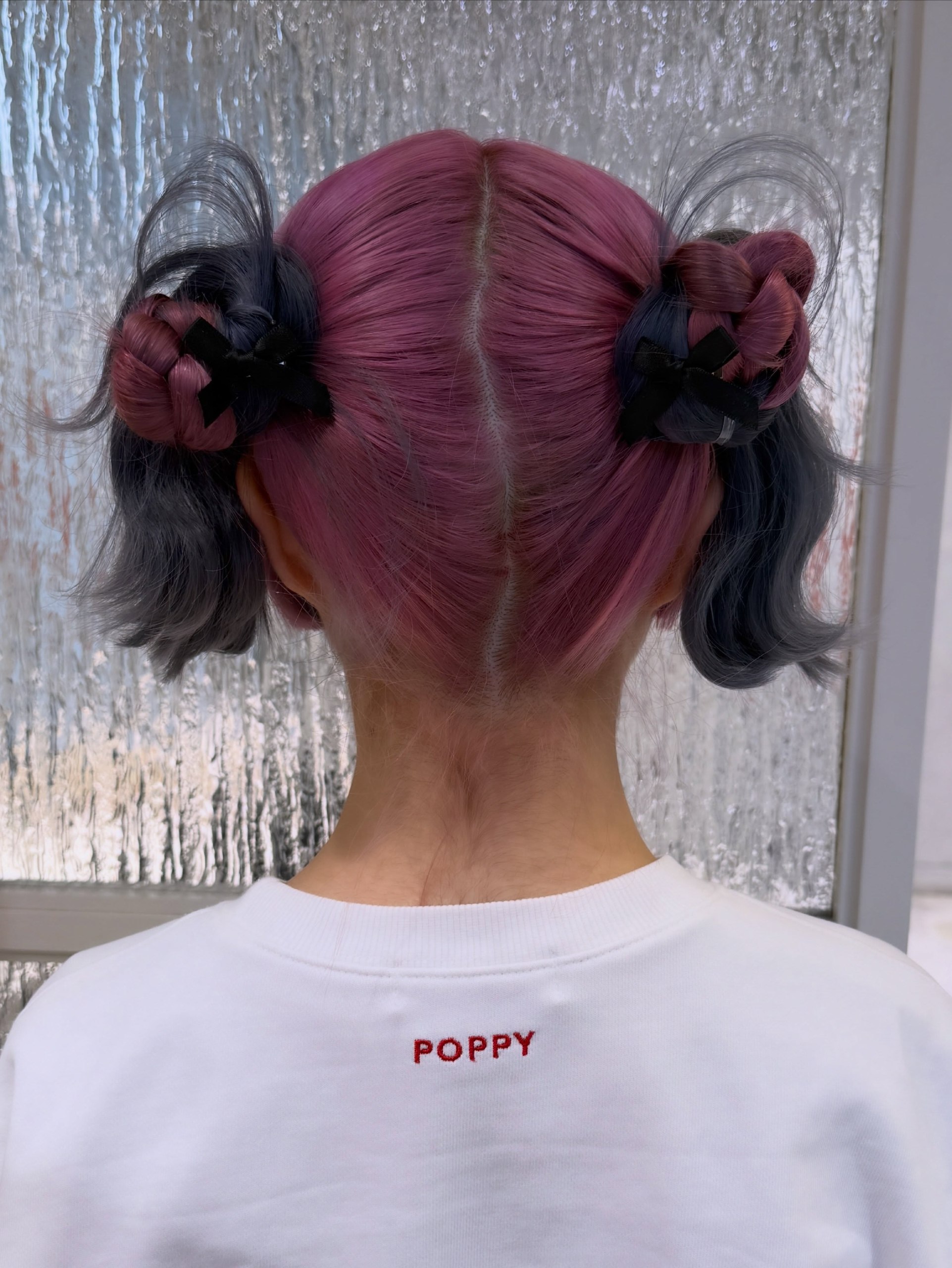 Two-Tone Braided Space Buns With Loose Curls