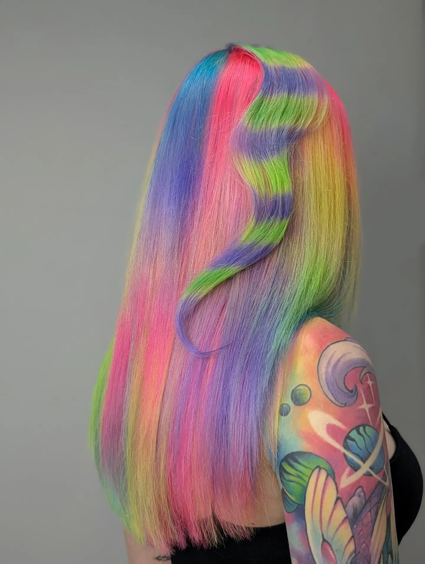 Vibrant Rainbow Striped Hair with Soft Waves