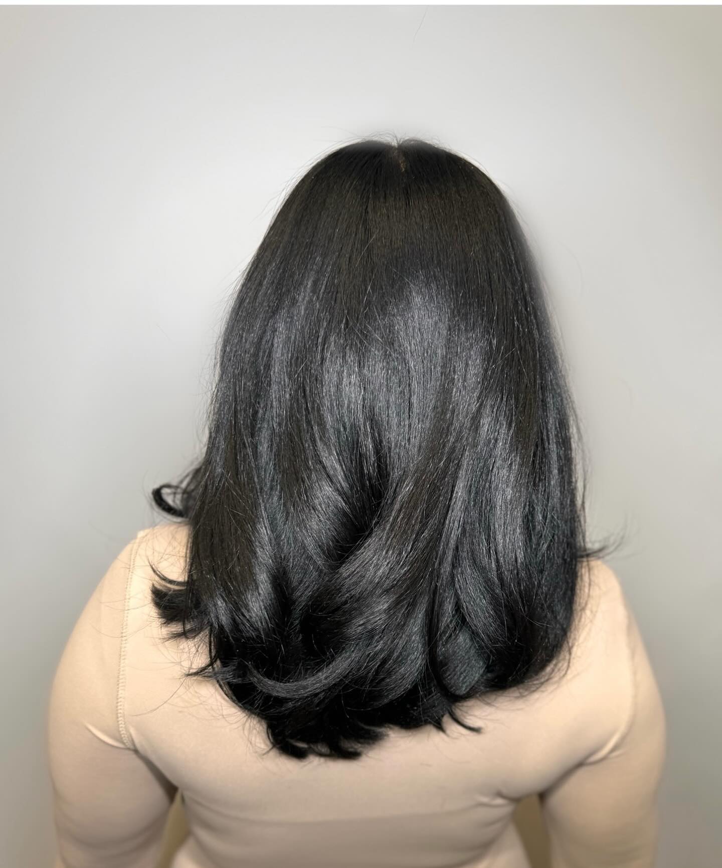 Voluminous Black Layers With Subtle Inch Outward Curls