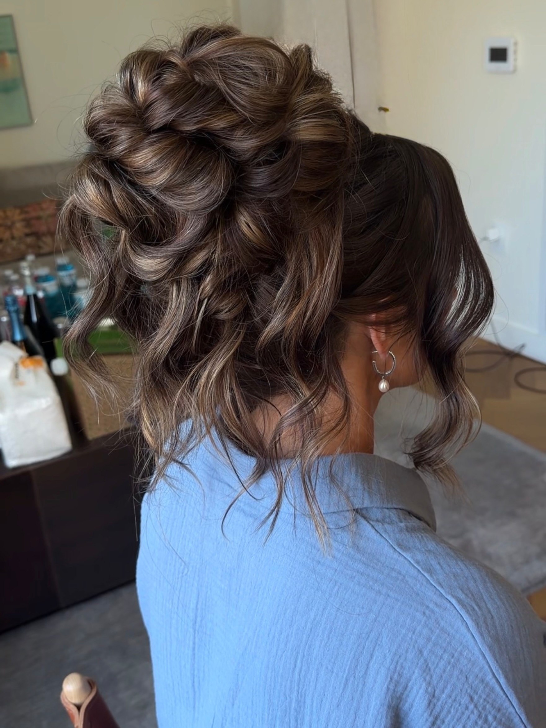 Voluminous Braided Updo With Loose Waves