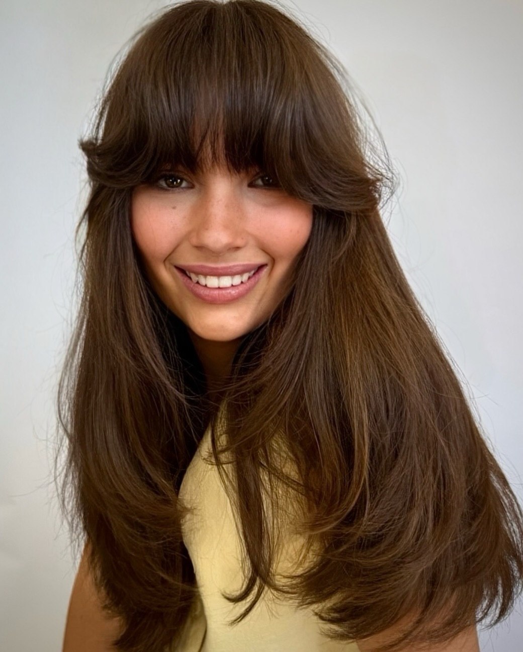 Voluminous Curtain Bangs With Rich Brunette Layers
