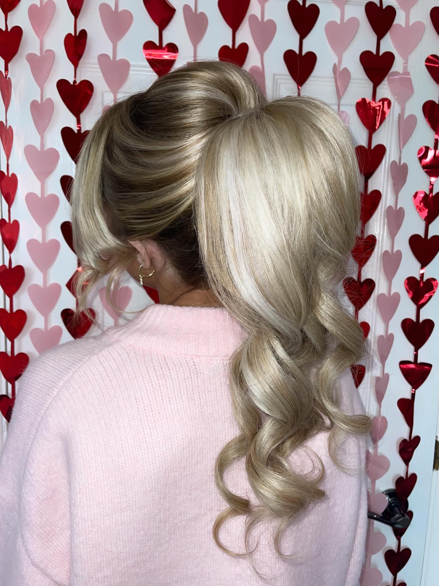 Voluminous High Ponytail With Loose Curls