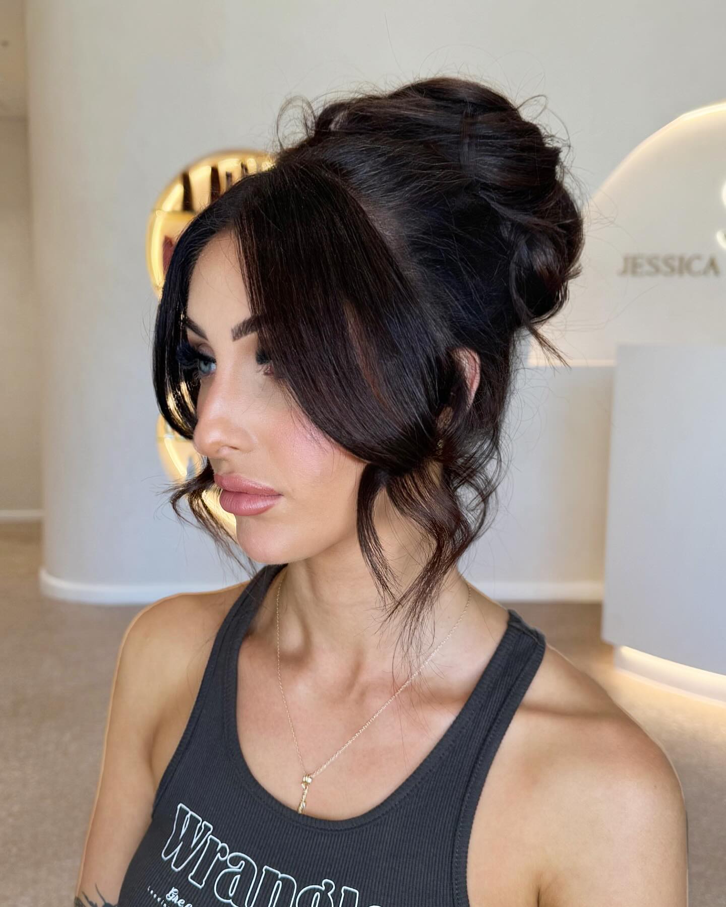 Voluminous High Updo With Curtain Bangs
