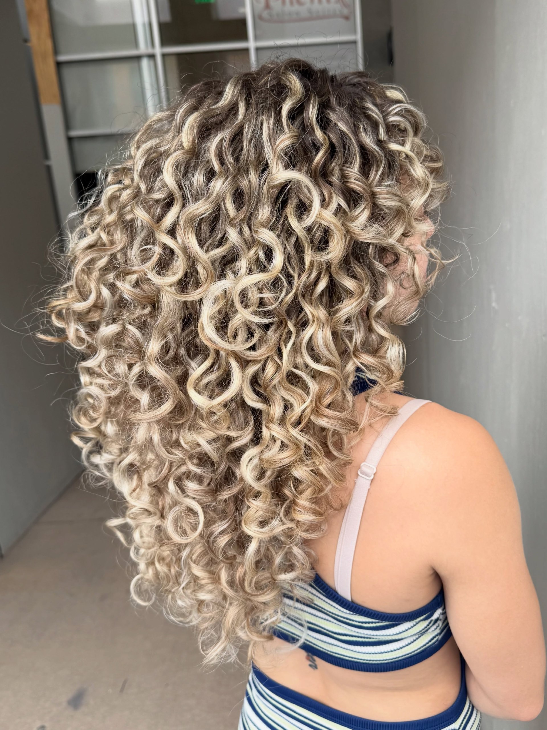 Voluminous Honey Blonde Curls With Dimension