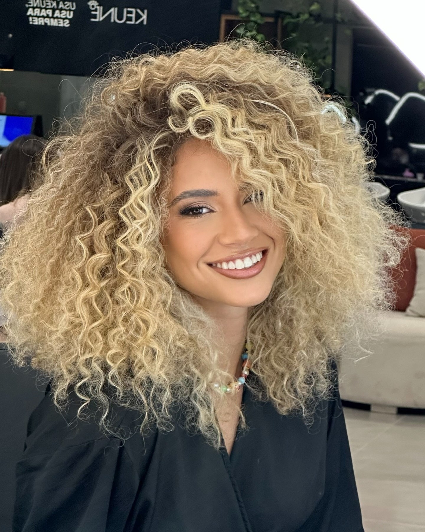 Voluminous Honey Blonde Curls With Sun-Kissed Highlights
