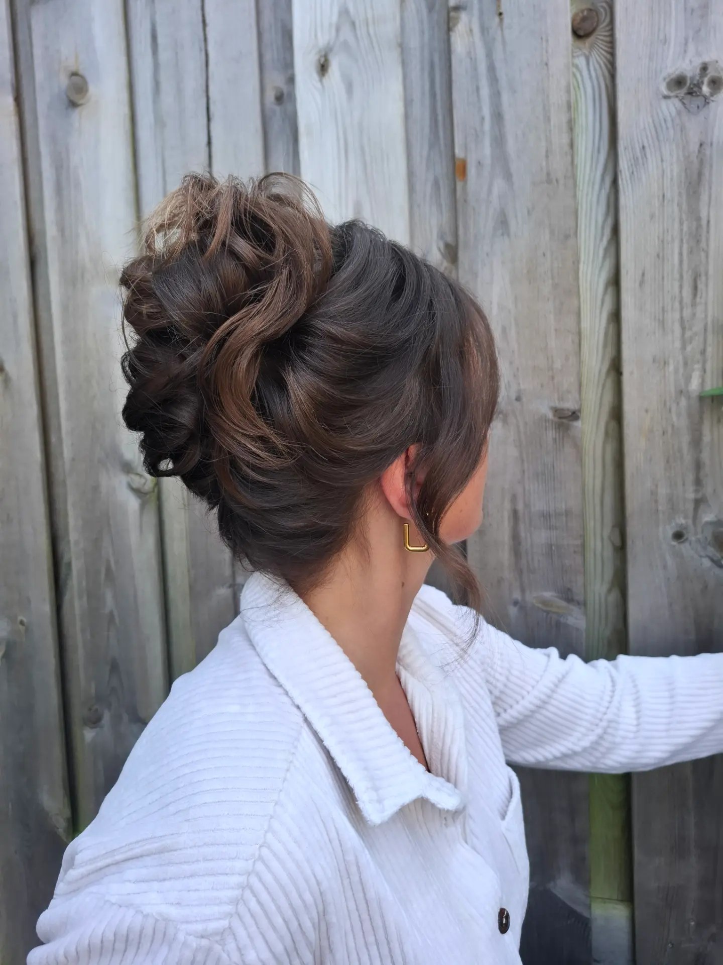 Voluminous Tousled Updo With Face-Framing Tendrils