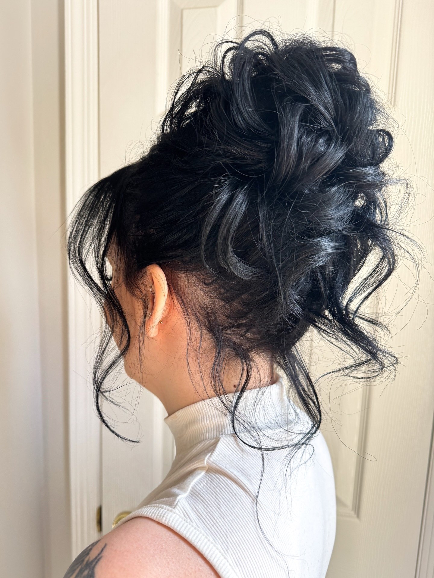 Voluminous Tousled Updo With Wispy Face-Framing Strands