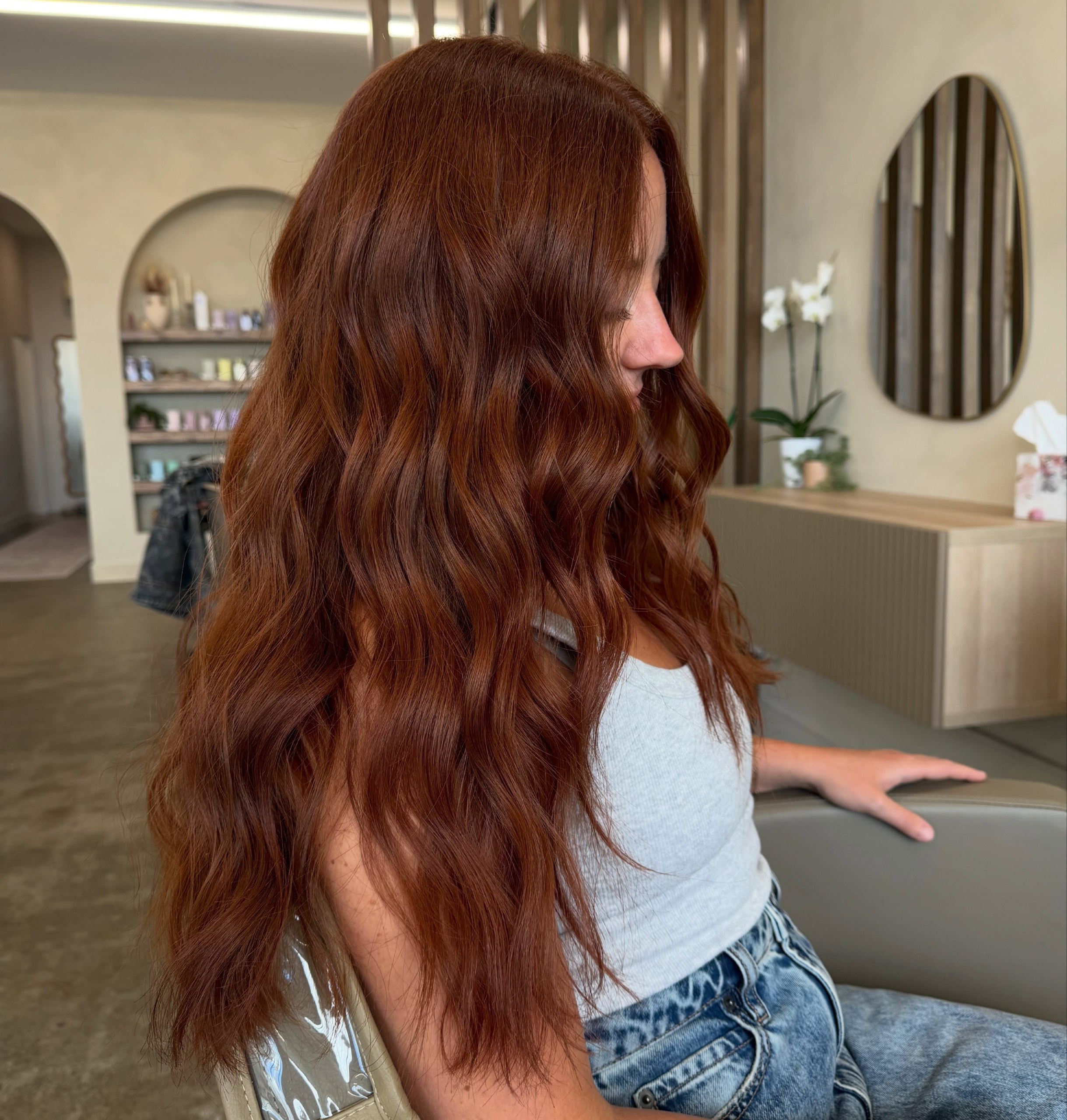 Warm Copper Waves With Face Framing Layers