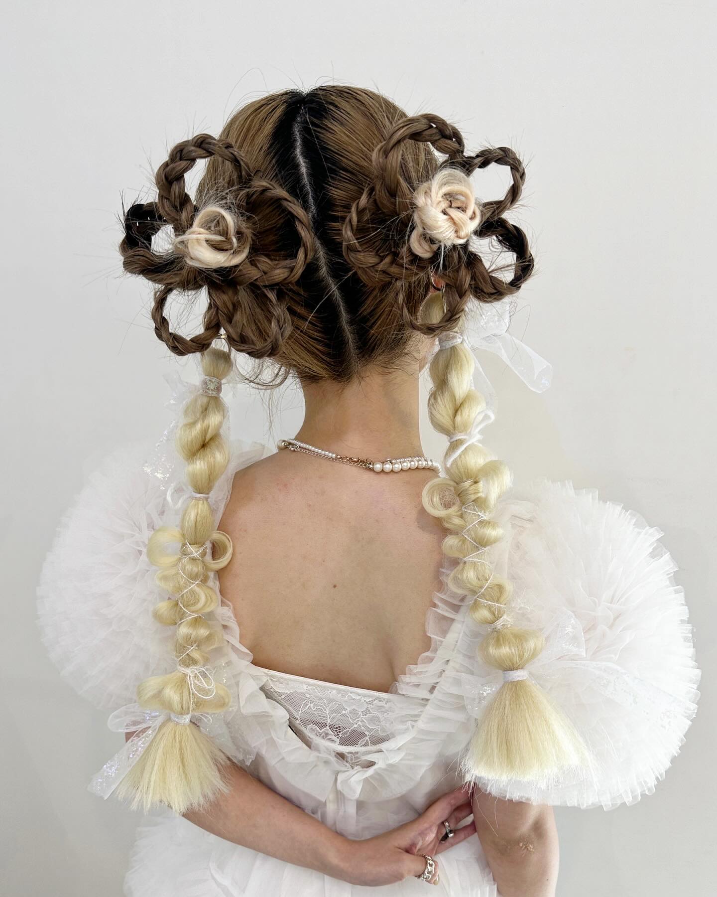 Whimsical Braided Flower Updo With Cascading Pigtails
