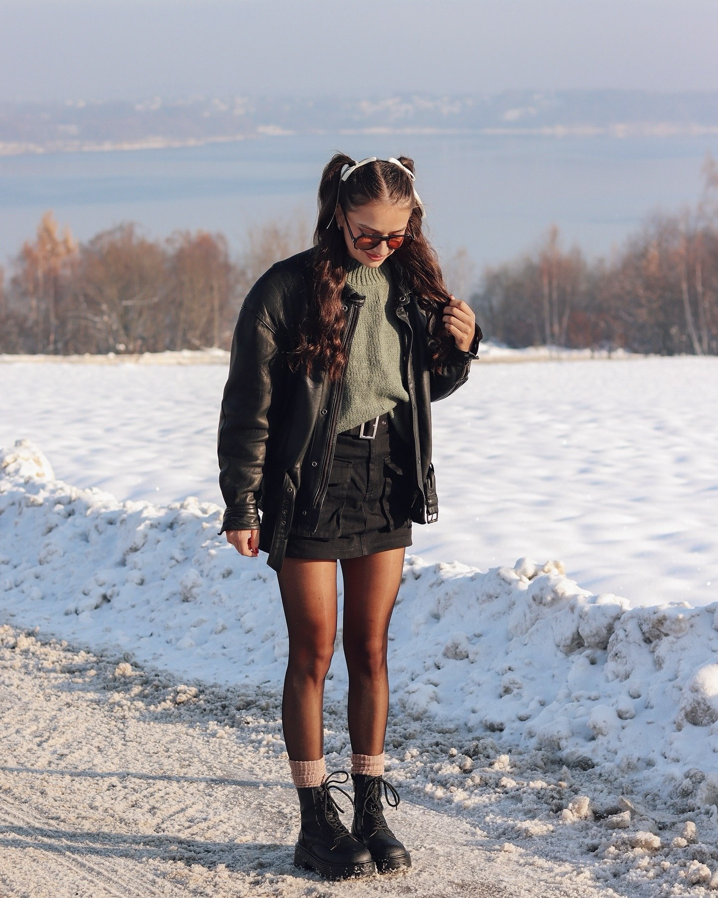 Black Leather Jacket With Green Knit And Mini Skirt